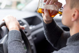 Man drinking alcohol and driving