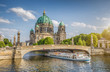 canvas print picture - Berlin Cathedral with ship on Spree river at sunset, Berlin Mitte, Germany
