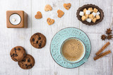 Fototapeta Uliczki - Coffee with milk and cookies top view