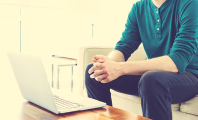 Wall Mural - Man on a laptop in bright room