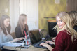 © olly - Girls at the internet cafe