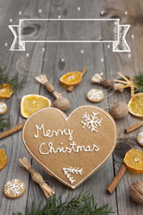 Christmas heart shaped gingerbread background. Winter holidays atmosphere. Snoflakes. Hand drawn ribbon for copy.Perfect for greeting cards, flyers, etc.Written in english