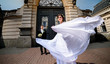 © IVASHstudio - young and beautiful bride and groom standing together outdoors