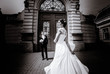 © IVASHstudio - young and beautiful bride and groom standing together outdoors