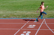 © Iuliia Sokolovska - Kids sport, child running on stadium track, training and fitness concept
