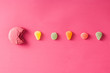 Macaroon with jelly beans on pink background