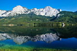 Fototapeta Góry - beautiful mountains landscape with water sea and green gras daylight daytime