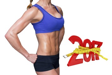 Poster - Composite image of fit woman with hand on hip 
