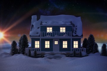 Composite image of illuminated house covered in snow