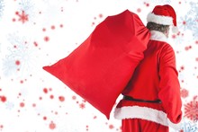 Composite Image Of Santa Claus Carrying Red Bag Full Of Gifts