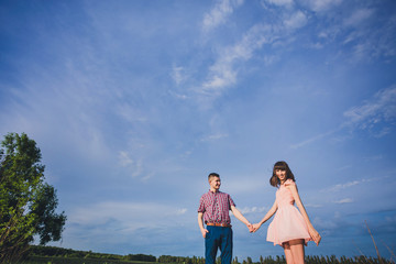 young couple in love together on nature