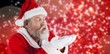© vectorfusionart - Composite image of santa claus in eyeglasses blowing invisible s