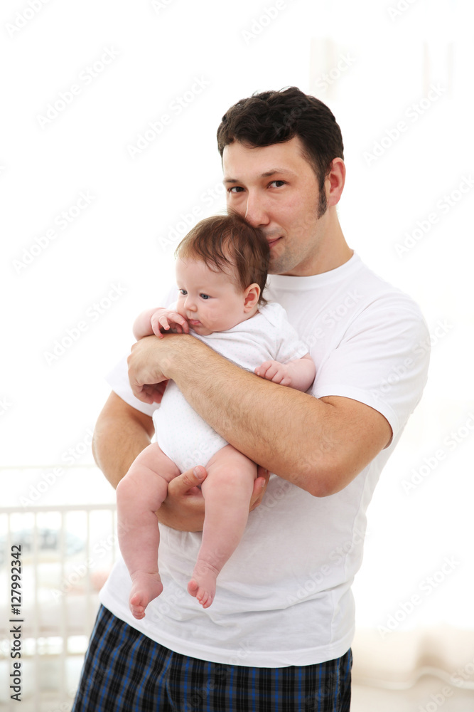 Father with baby at home