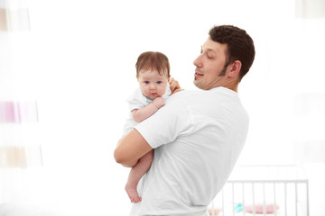 Father with baby at home