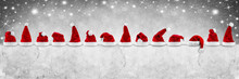 Red White Christmas Santa Hats On Concrete Wall Empty Billboard Isolated On White Background Gray Sky Stars Bokeh Background