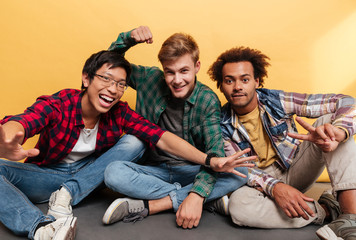 Sticker - Three happy excited young men friends having fun together