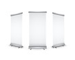 Three blank realistic roll-up banners with shadow on white