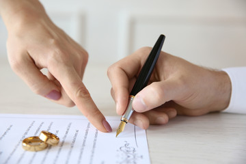 Wall Mural - Man signing marriage contract, closeup