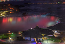 Colorful Lights Of Niagara Falls Lit At Night 