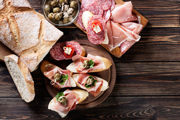 Sticker - Spanish tapas with slices jamon serrano, salami, olives and chee