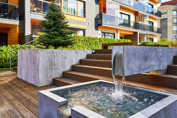 Decorative fountain and Modern complex of residential buildings