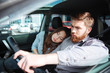 © Drobot Dean - Fashion couple in car