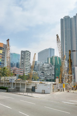 Wall Mural - Modern Skyscrapers and construction works on the road in Kowloon