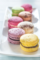 Wall Mural - Colorful macarons on the white plate