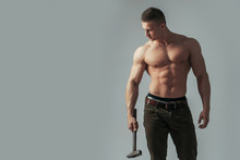 Sexy Muscular Man With Hammer