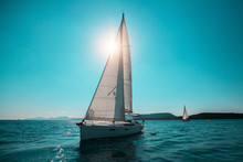 Sailing Ship Yachts With White Sails In The Open Sea. Luxury Boats.