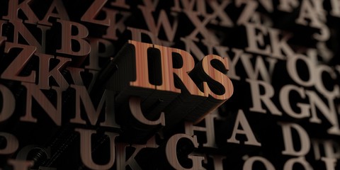 Irs - Wooden 3D rendered letters/message.  Can be used for an online banner ad or a print postcard.