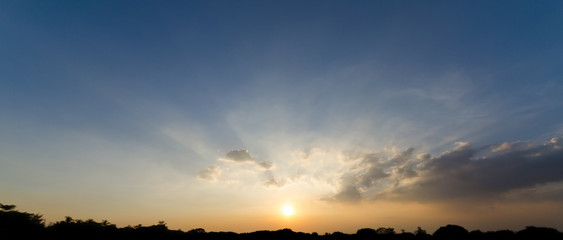 Wall Mural - beautiful sunbeam through cloud and sunset sky