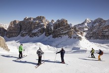 Group Of Skiers On The Slopes Of Passo Falzarego, Cortina D'Ampezzo, Italy