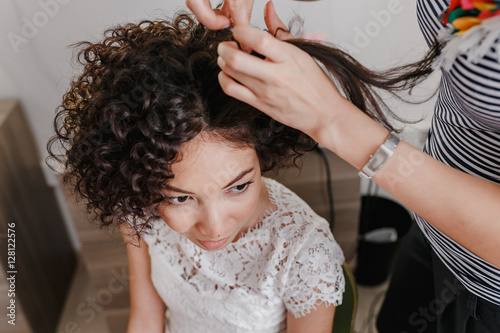 Professional Hairdresser Artist Making Curly Hairstyle To Charming