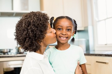 Wall Mural - Mother kissing daughter