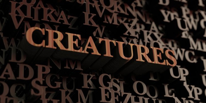 Creatures - Wooden 3D rendered letters/message.  Can be used for an online banner ad or a print postcard.