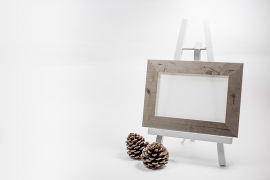 Blank picture frame on easel.Photo on white background with shadow.