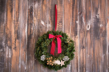 Christmas Wreath On The Wooden Background