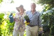 © WavebreakMediaMicro - Portrait of senior man and woman gardening with equipment