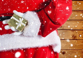 Poster - Santa hiding christmas gift behind his back