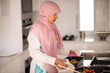 © Jasmin Merdan - Muslim Arabic traditional woman in kitchen preparing food for lu