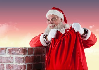 Wall Mural - Santa claus carrying gift bag