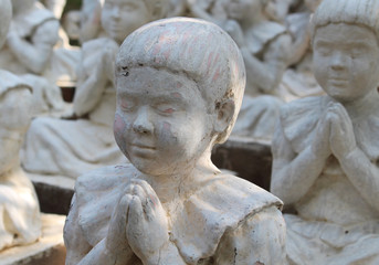 girl statue in meditation 