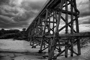 Trestle bridge in Kilcunda, Australia, 91 meter long built over the Bourne Creek.  Black and white.