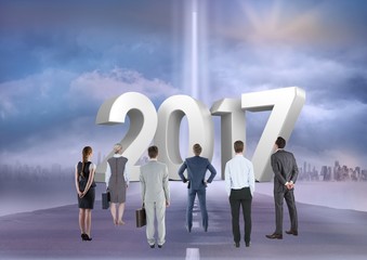 Canvas Print - Composite image of 2017 with business people on road to success