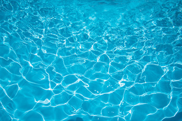  Ripple Water in swimming pool with sun reflection