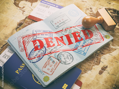 Fotografía Passport with denied visa stamp on the map of the world and airl