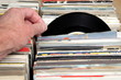 Hand of a man looking at vinyl 7