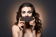 © Africa Studio - Beautiful girl with chocolate on dark background