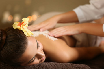 Poster - Young woman receiving salt massage in spa salon